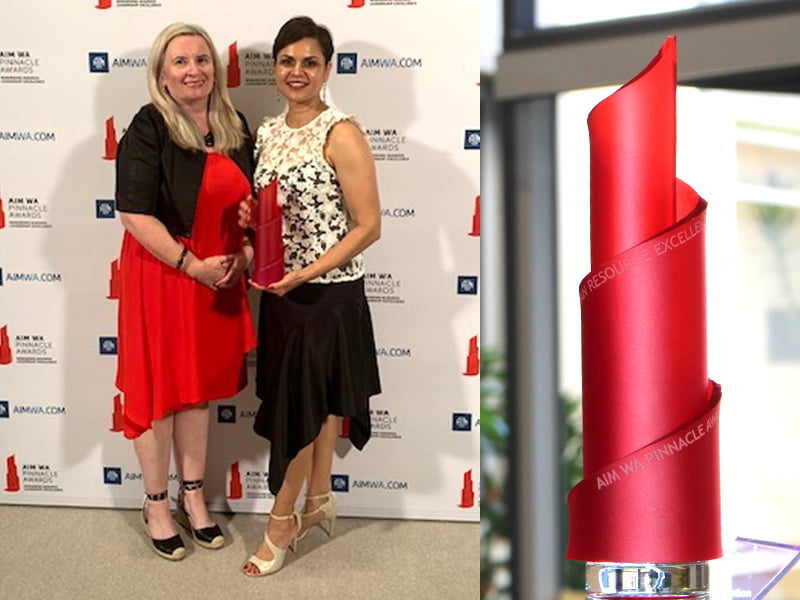 Dr Clare Allen, Chief Executive Officer VisAbility with Nevellene Linquist, Executive Manager People and Culture holding the trophy.
