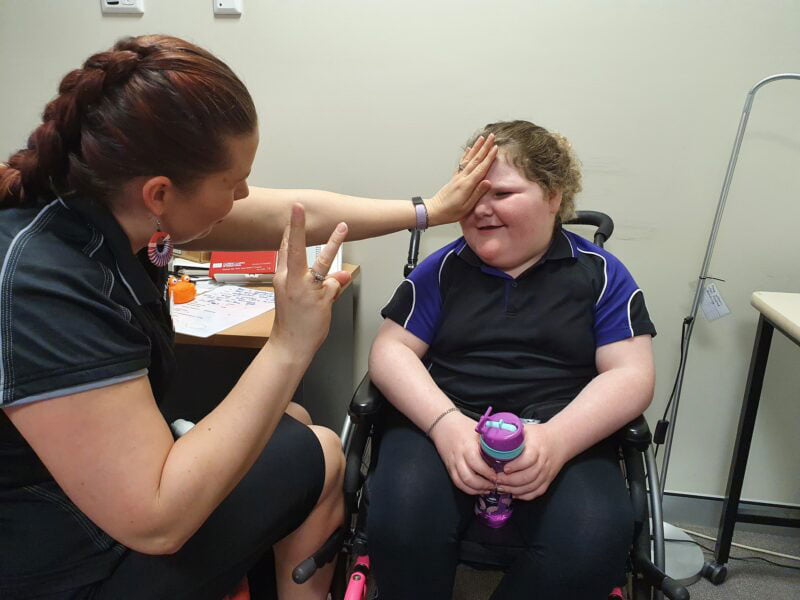 Amy undertakes a vision test with Charlee