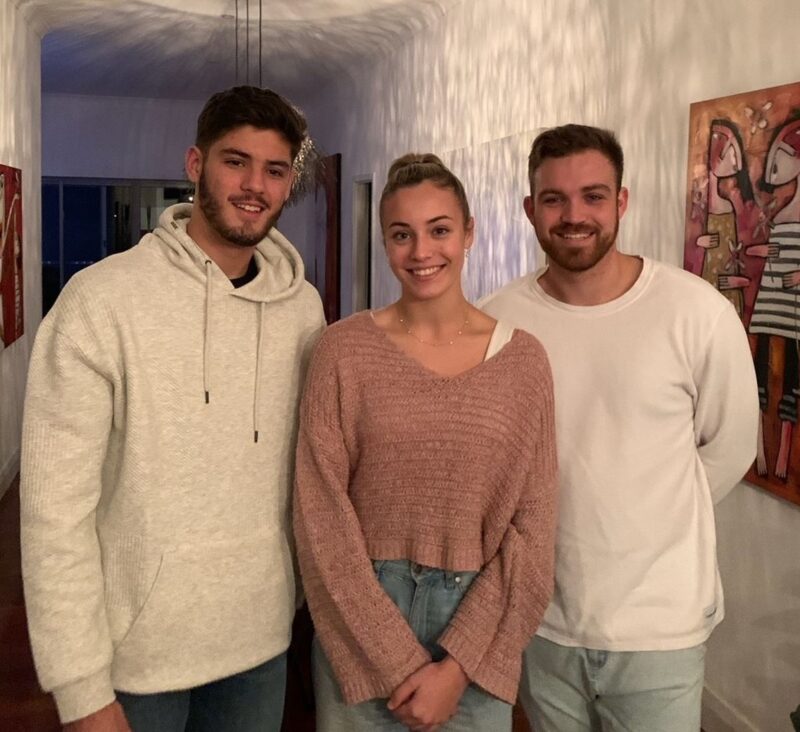 Jackson next to his brother and sister